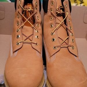 2 pairs of boots and a pair of sneakers